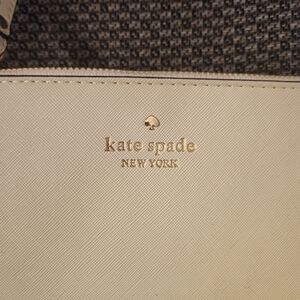 Cream colored Kate Spade Wristlet